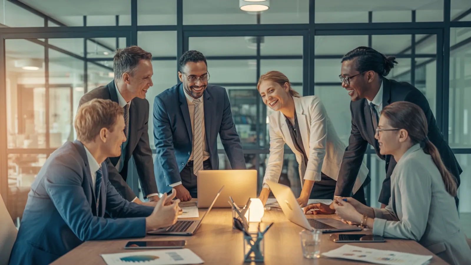 Diverse professional team collaborating in a modern glass-walled office representing E-E-A-T experience, expertise, authoritativeness, and trust signals